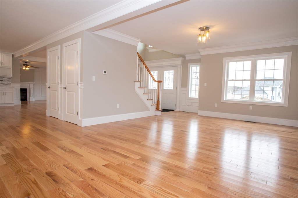49 Spectacle Hill Road Bolton, MA 01740 - Photo 22 of 42 an empty room with wooden floor and windows