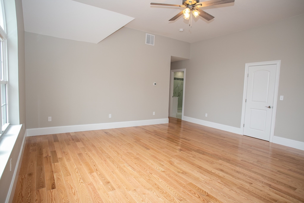 49 Spectacle Hill Road Bolton, MA 01740 - Photo 30 of 42 wooden floor in an empty room with a window