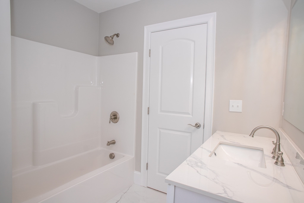 49 Spectacle Hill Road Bolton, MA 01740 - Photo 39 of 42 a bathroom with a bathtub and a sink