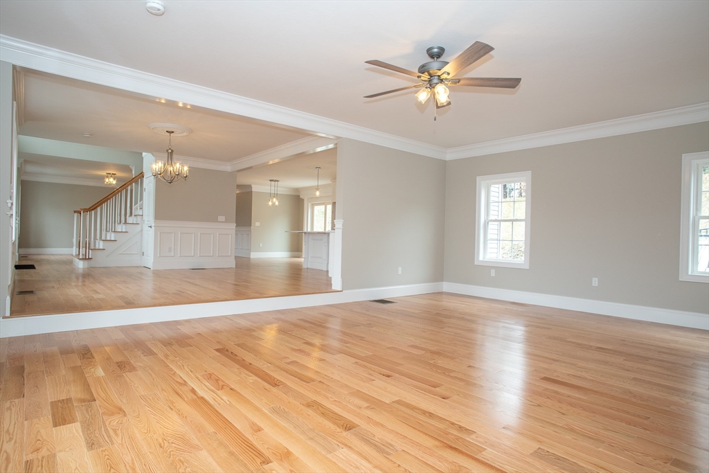 49 Spectacle Hill Road Bolton, MA 01740 - Photo 10 of 42 a view of an empty room with wooden floor and a ceiling fan