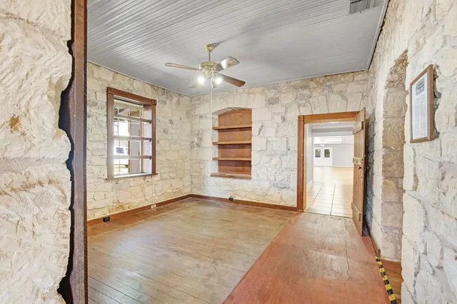 a view of a hallway with a room