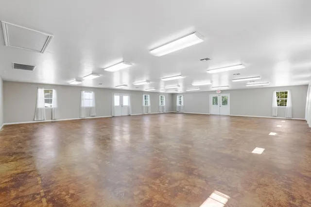 a view of a kitchen with white cabinets