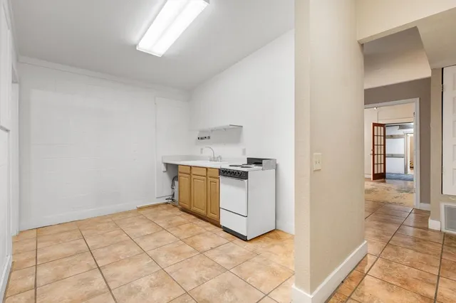 a bathroom with a sink mirror and toilet