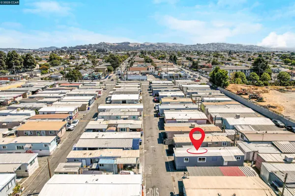 an aerial view of residential houses with outdoor space