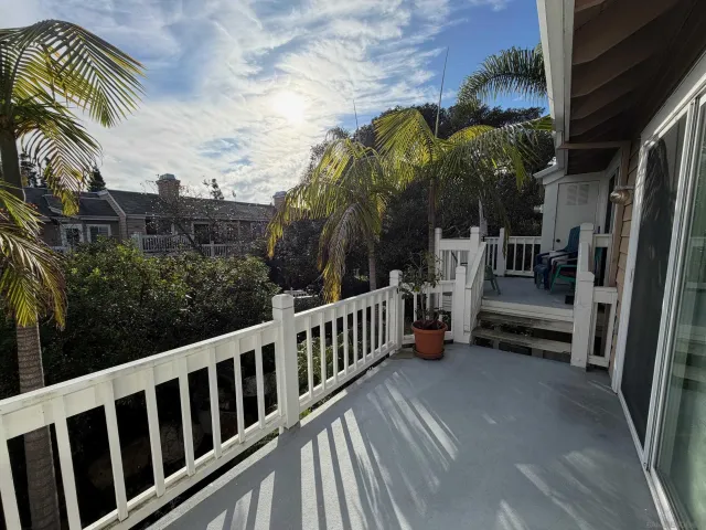 a view of balcony with furniture