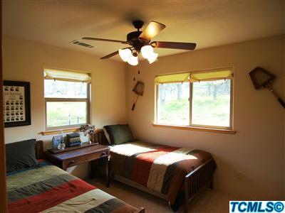 40131 Pierce Drive Three Rivers, CA 93271 - Photo 15 of 25 a bedroom with a bed and wooden floor