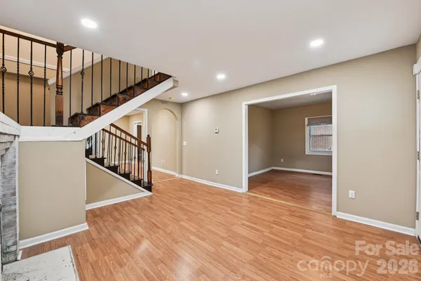 a view of livingroom with hardwood floor and staircase