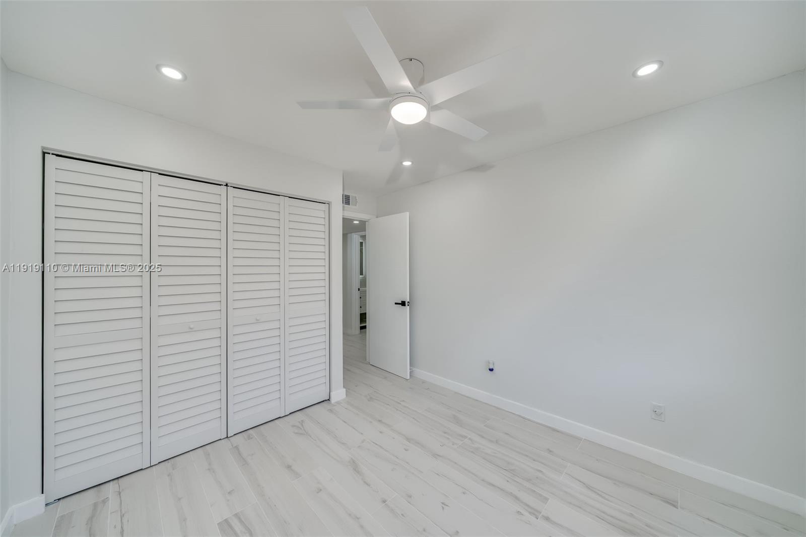 4155 Southwest 66th Terrace, Unit 104 Davie, FL 33314 - Photo 13 of 25 wooden floor in an empty room