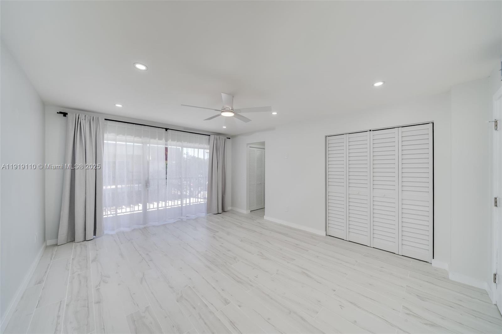4155 Southwest 66th Terrace, Unit 104 Davie, FL 33314 - Photo 17 of 25 a view of an empty room with wooden floor