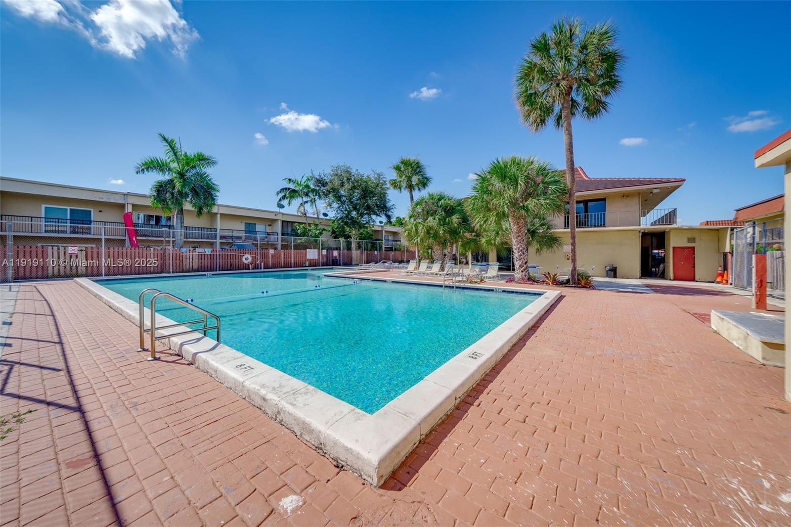 4155 Southwest 66th Terrace, Unit 104 Davie, FL 33314 - Photo 20 of 25 a view of a house with a swimming pool