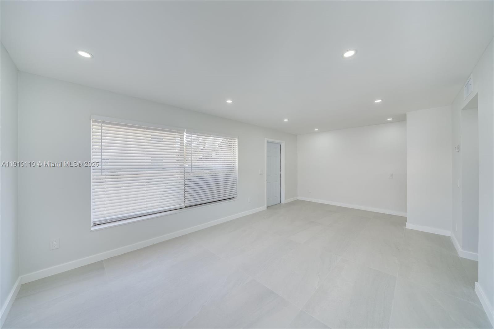 4155 Southwest 66th Terrace, Unit 104 Davie, FL 33314 - Photo 2 of 25 an empty room with windows and closet