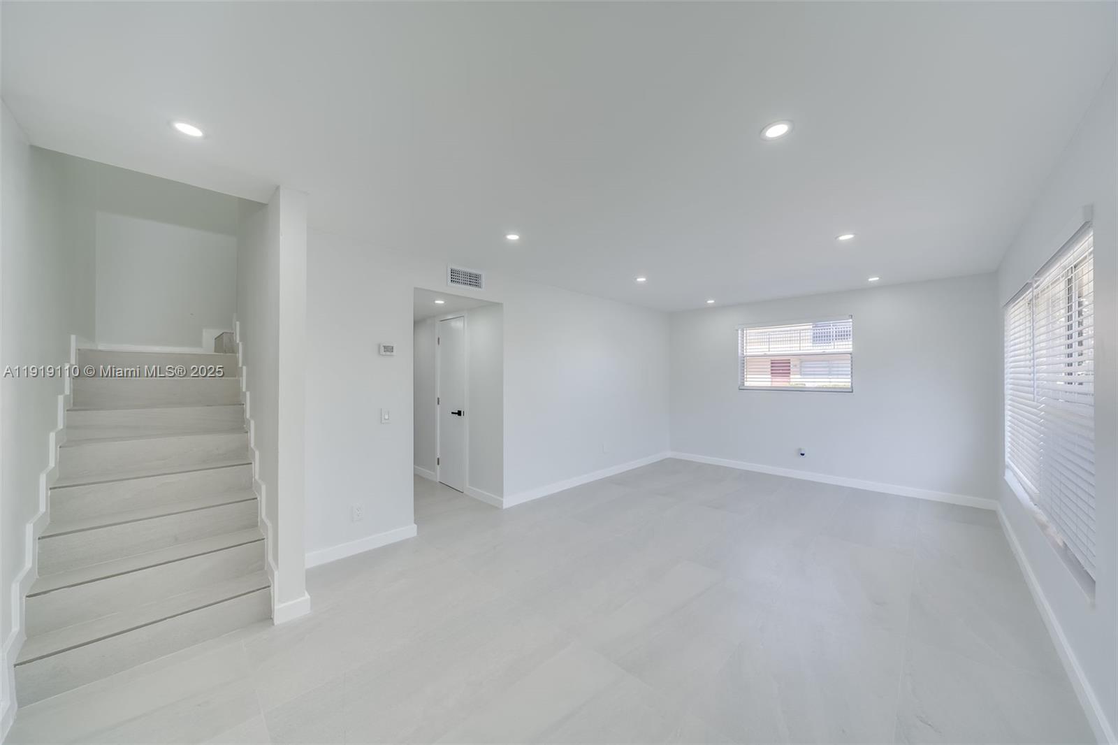 4155 Southwest 66th Terrace, Unit 104 Davie, FL 33314 - Photo 3 of 25 an empty room with windows