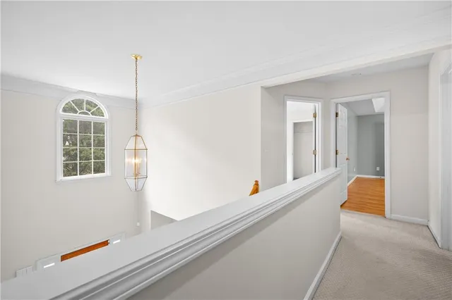 a view of an empty room with windows