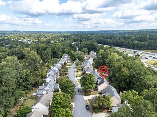 an aerial view of residential house with outdoor space and street view