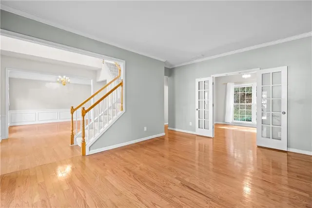 a view of an entryway with wooden floor