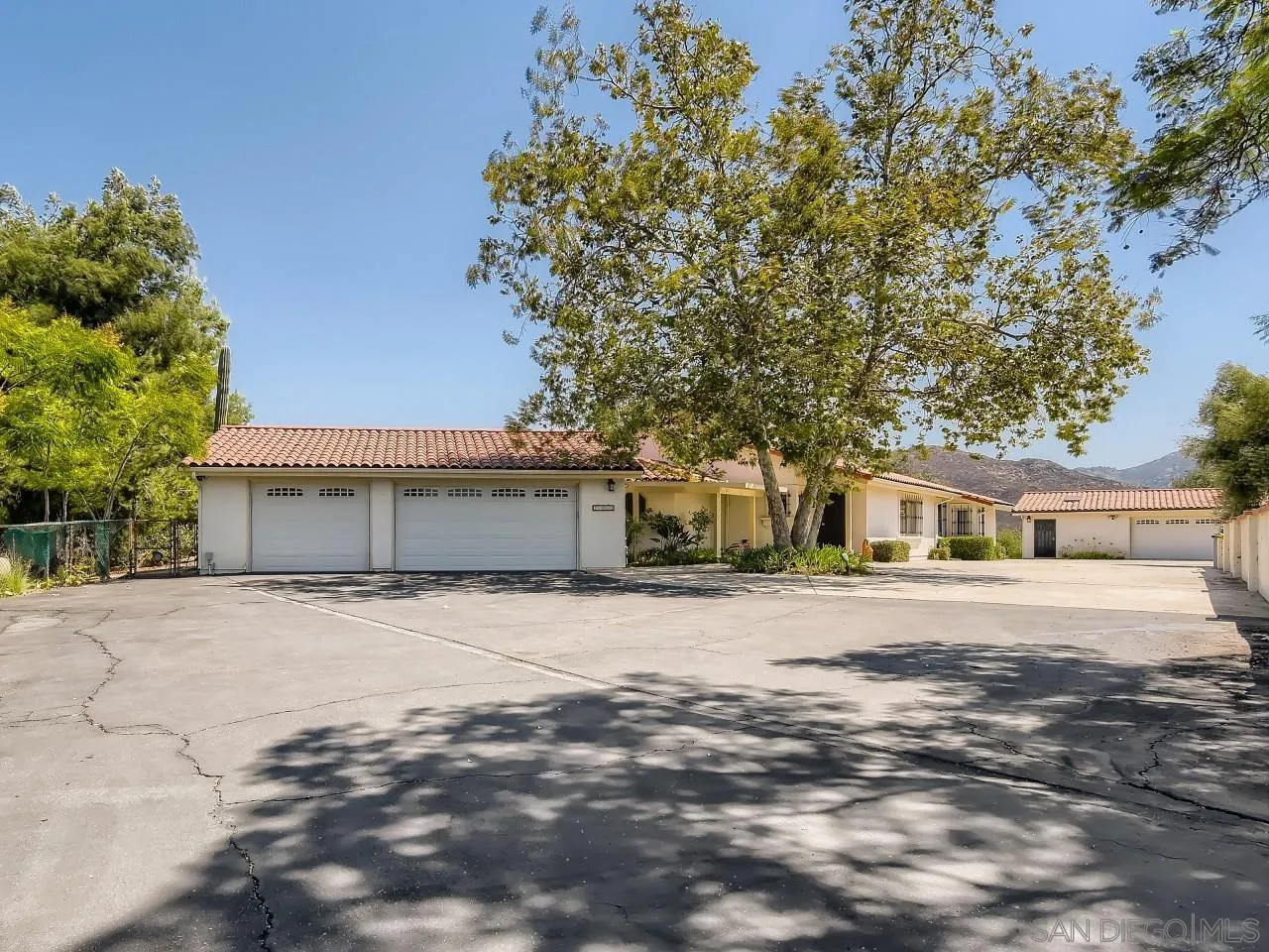 16363 Espola Road Poway, CA 92064 - Photo 1 of 43 a front view of house with yard and trees