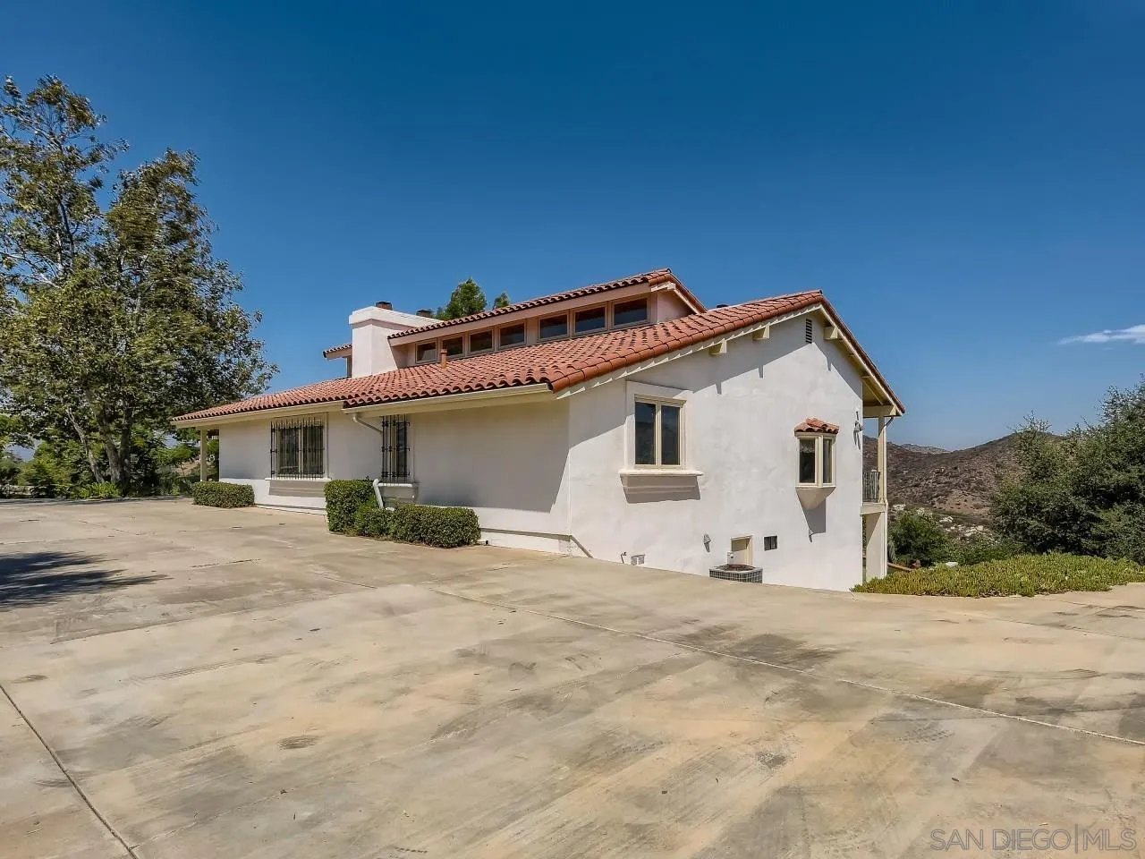 16363 Espola Road Poway, CA 92064 - Photo 3 of 43 a view of a house with a yard