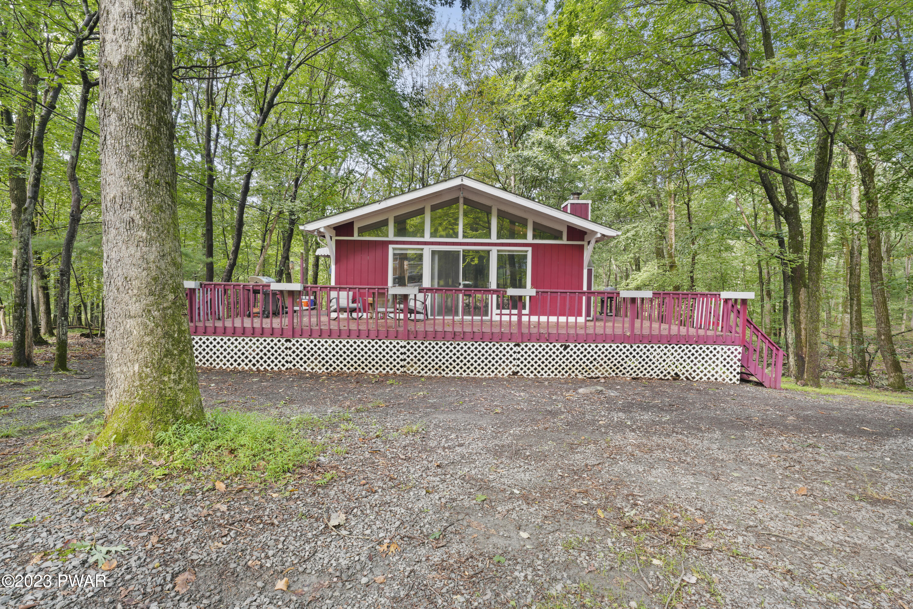 161 Butternut Road Milford, PA 18337 - Photo 2 of 26 a view of a small house in the forest