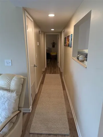 a view of hallway with furniture