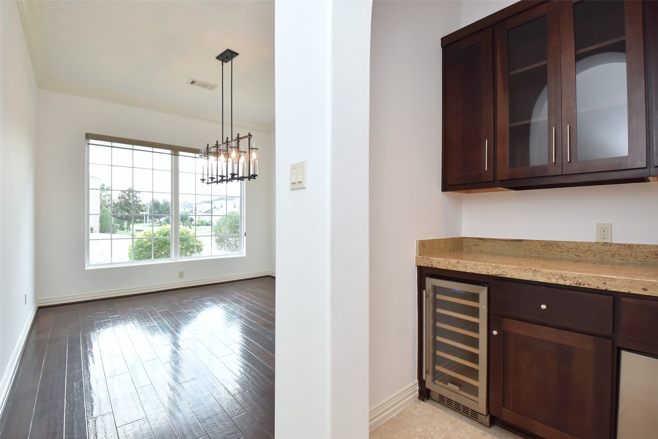 2014 Split Branch Court Houston, TX 77077 - Photo 12 of 47 a kitchen with granite countertop a stove and a wooden floor