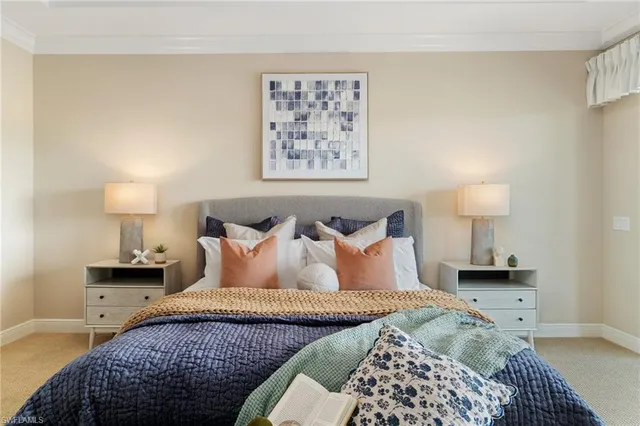 a spacious bedroom with a bed and a large window