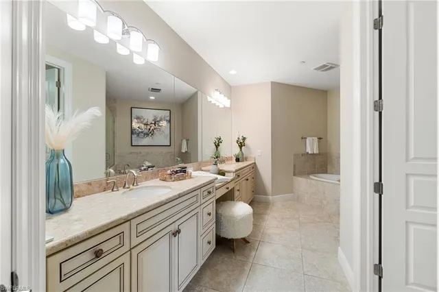 a bedroom with a bed and a lamp