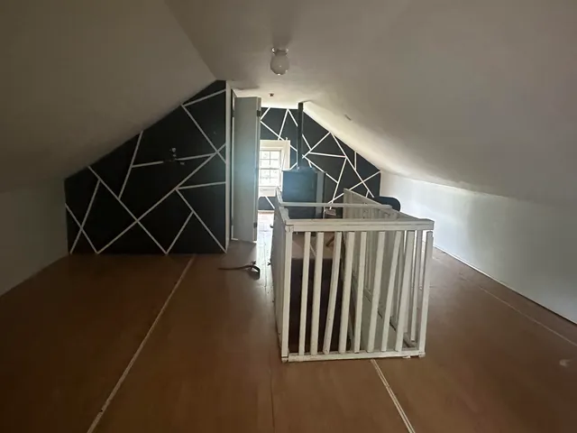 an entryway in a house with wooden floor