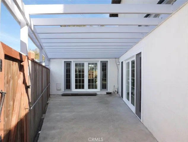 a view of a porch with wooden floor and stairs