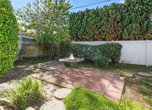 a view of a backyard with sitting area