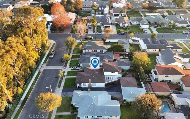 an aerial view of a houses with yard