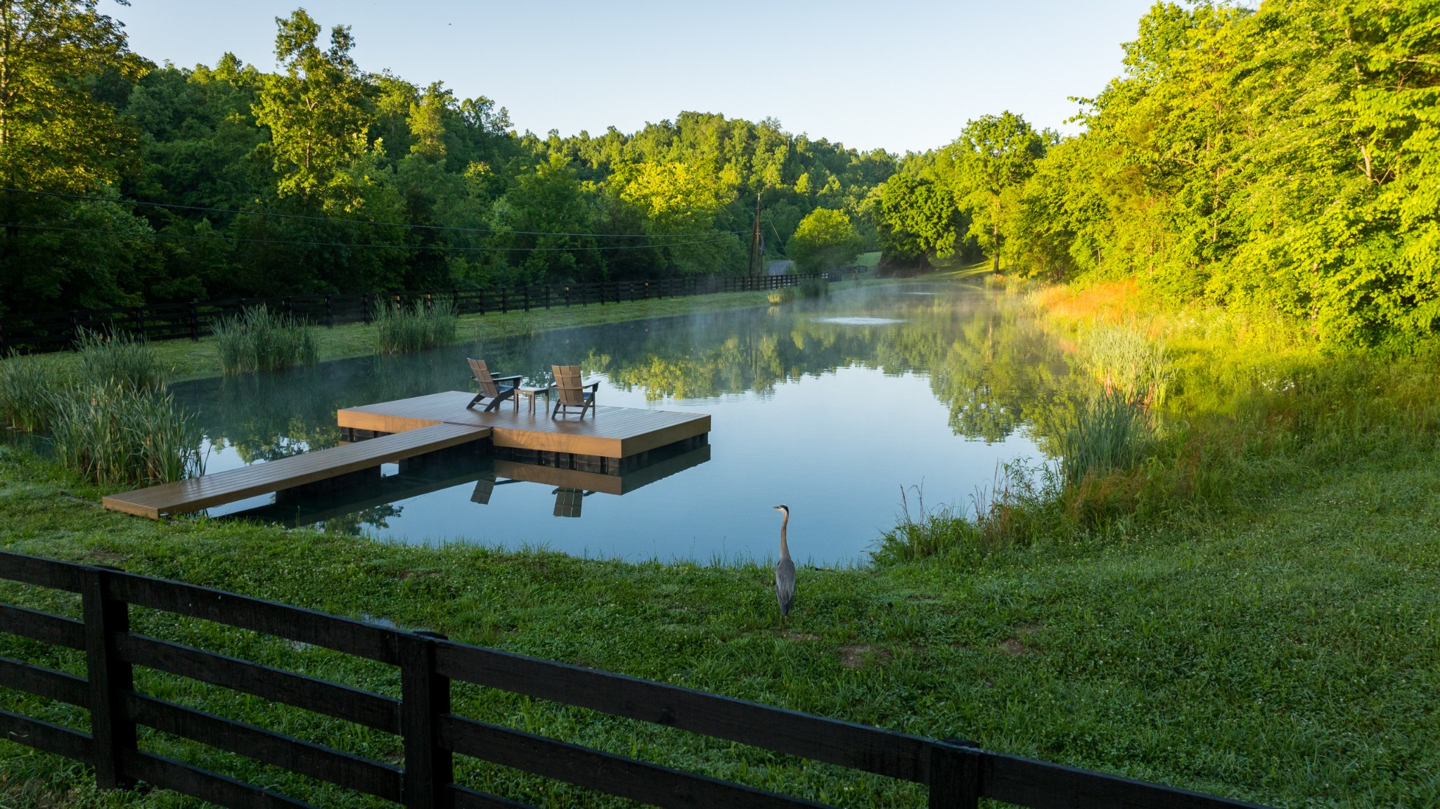 7556 Caney Fork Road Fairview, TN 37062 - Photo 2 of 47 a view of a lake with a house in the background