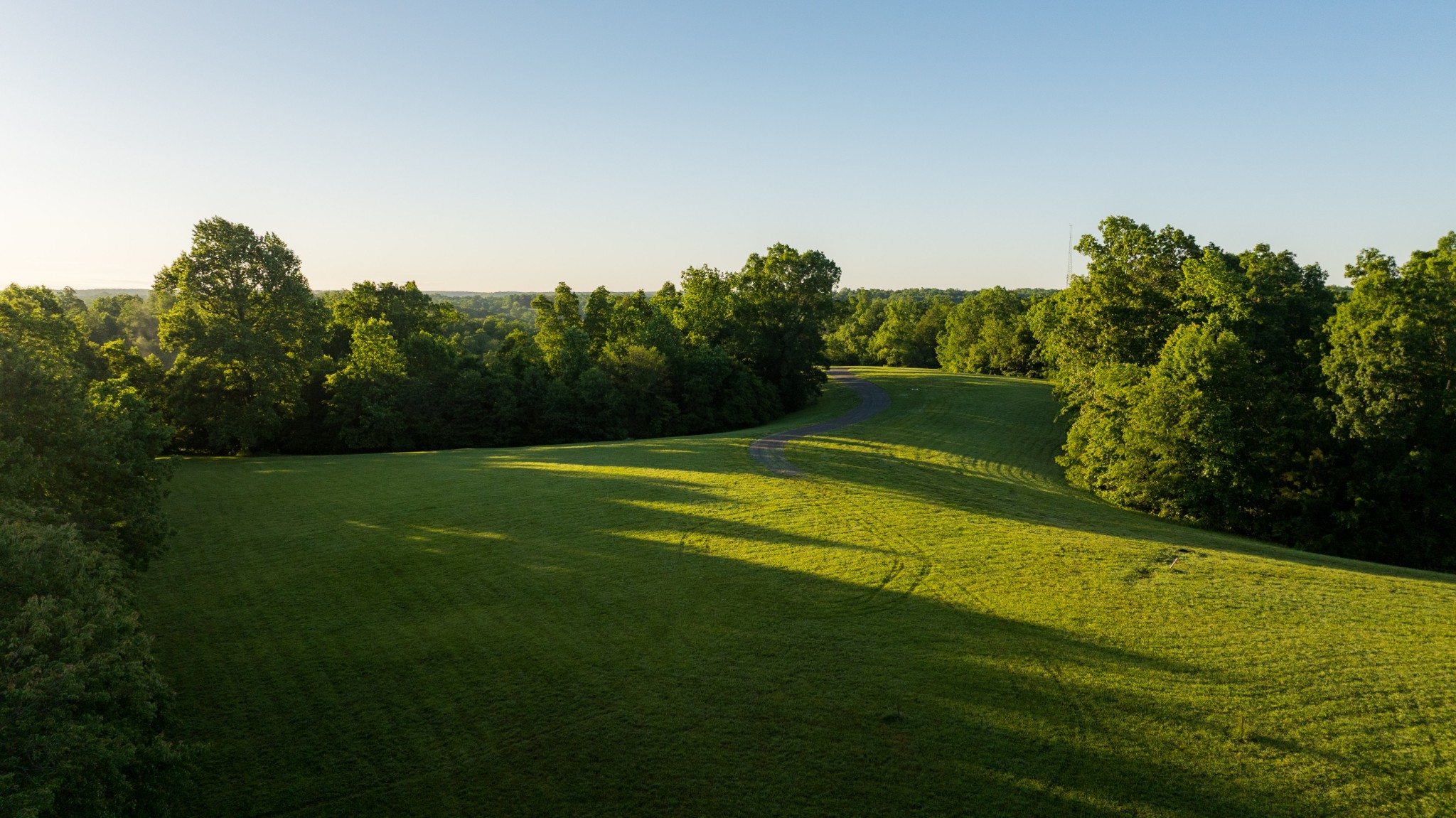 7556 Caney Fork Road Fairview, TN 37062 - Photo 5 of 47 a view of a golf course with a lake