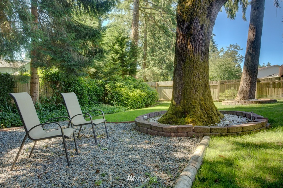 17510 24th Avenue Southeast Bothell, WA 98012 - Photo 2 of 20 a view of a chair and table in the garden