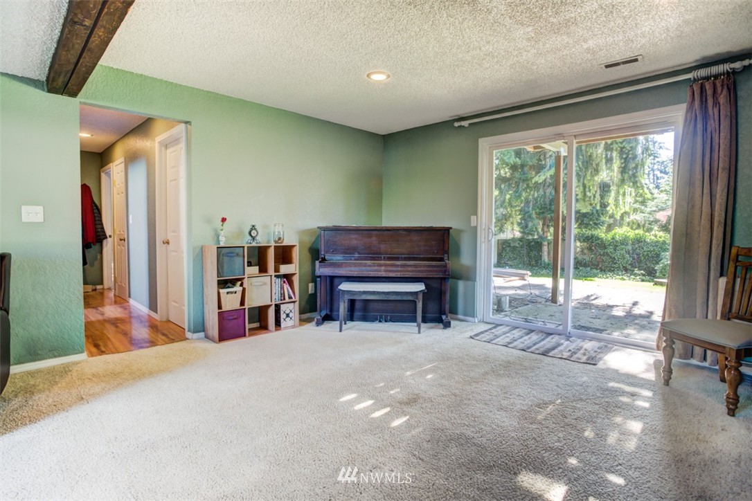 17510 24th Avenue Southeast Bothell, WA 98012 - Photo 12 of 20 a view of a room with furniture and a fireplace