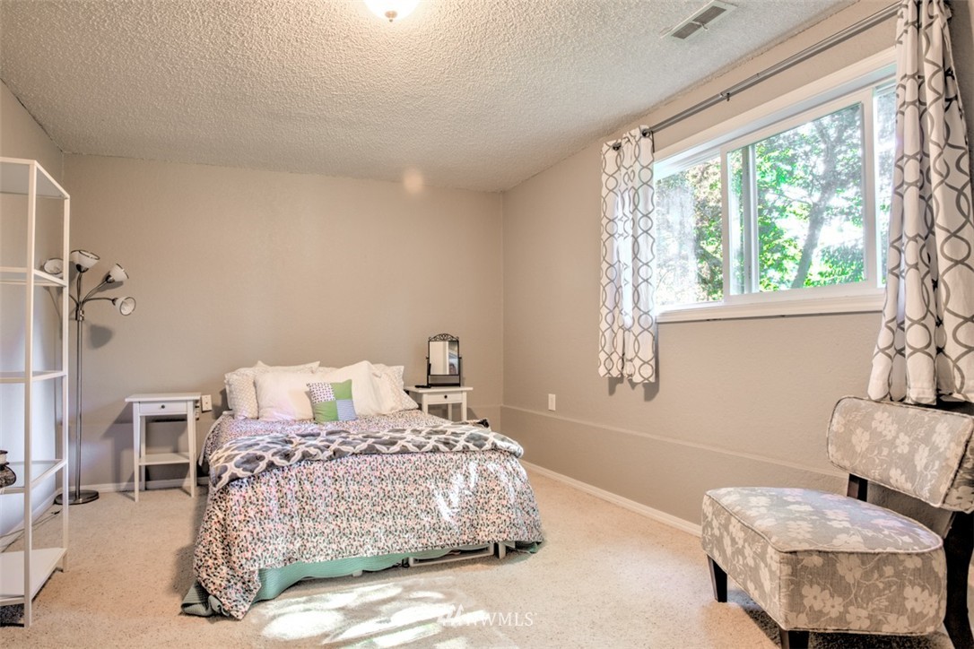 17510 24th Avenue Southeast Bothell, WA 98012 - Photo 17 of 20 a bedroom with a bed and a couch