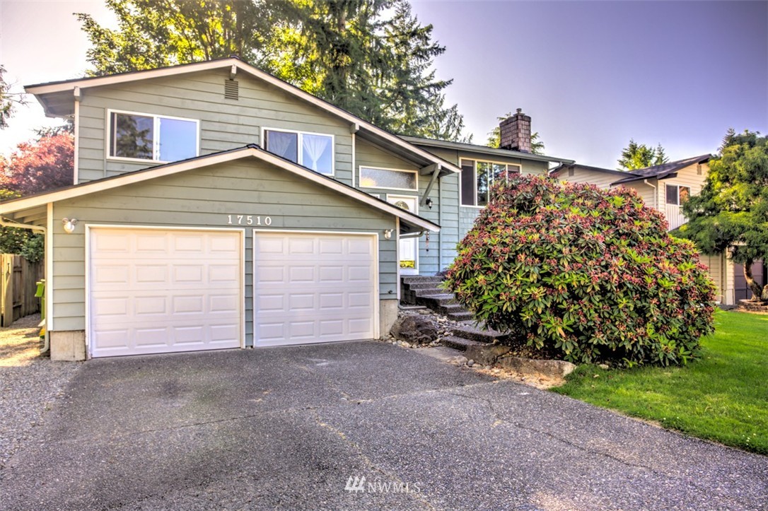 17510 24th Avenue Southeast Bothell, WA 98012 - Photo 19 of 20 a front view of a house with a yard and garage
