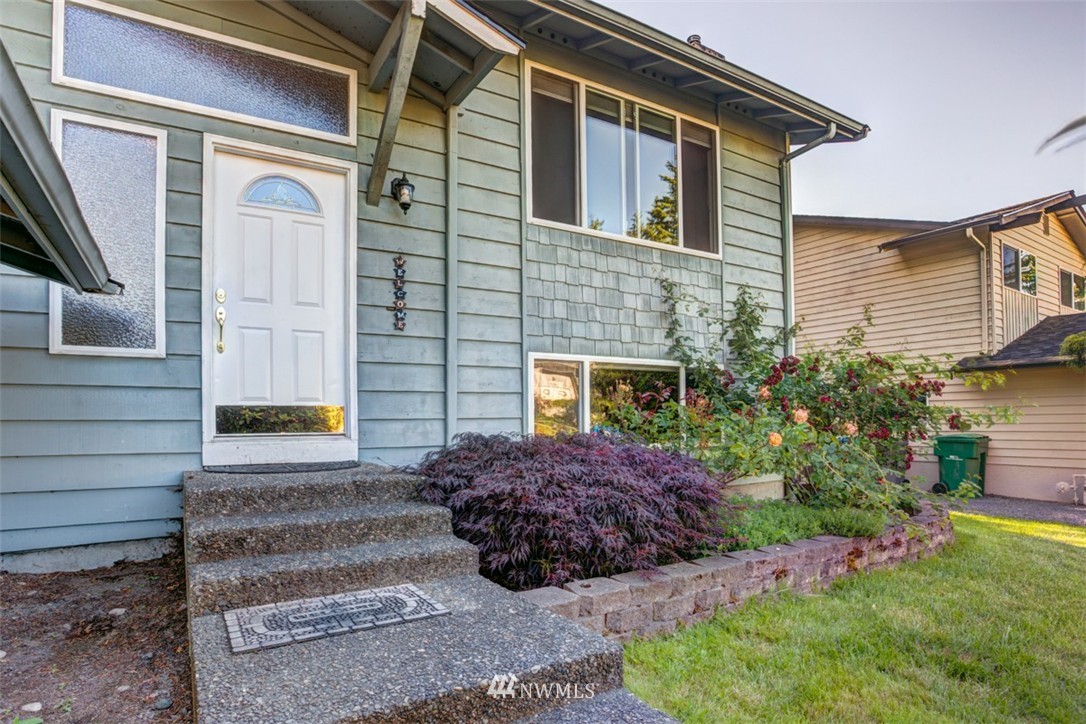 17510 24th Avenue Southeast Bothell, WA 98012 - Photo 20 of 20 a front view of a house with a garden