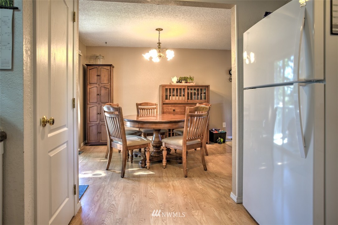 17510 24th Avenue Southeast Bothell, WA 98012 - Photo 9 of 20 a view of a dining room with furniture and wooden floor
