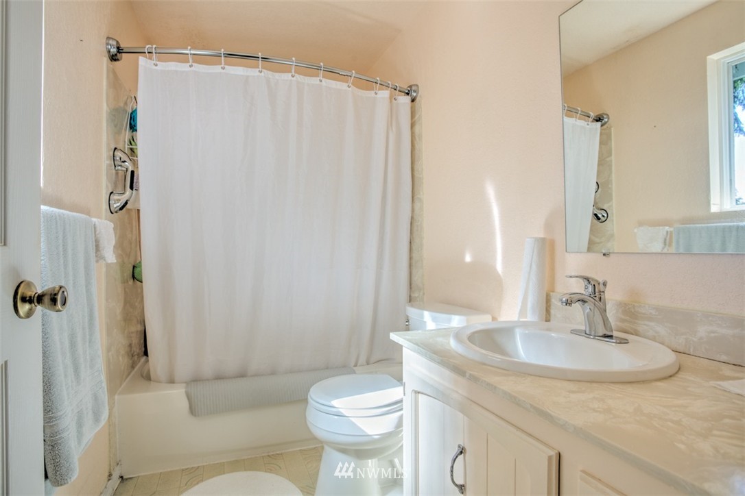 17510 24th Avenue Southeast Bothell, WA 98012 - Photo 10 of 20 a bathroom with a sink toilet and shower