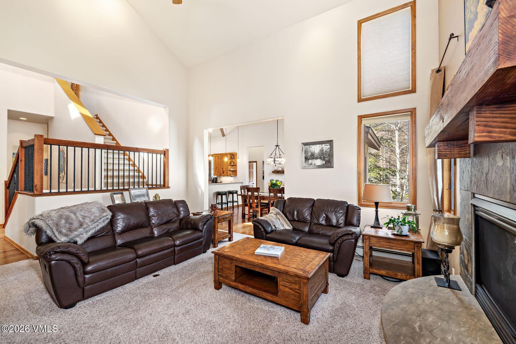 91 Creamery Trail Edwards, CO 81632 - Photo 9 of 44 a living room with furniture a fireplace and a large window