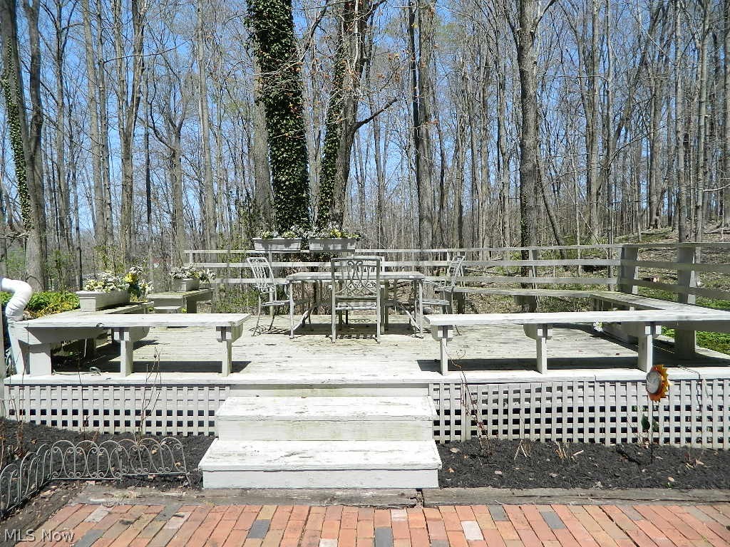 11735 Sperry Road Chesterland, OH 44026 - Photo 34 of 35 Just Outside of the Family Room is a Brick Paver Patio and this Raised Deck with Built In Bench Seating