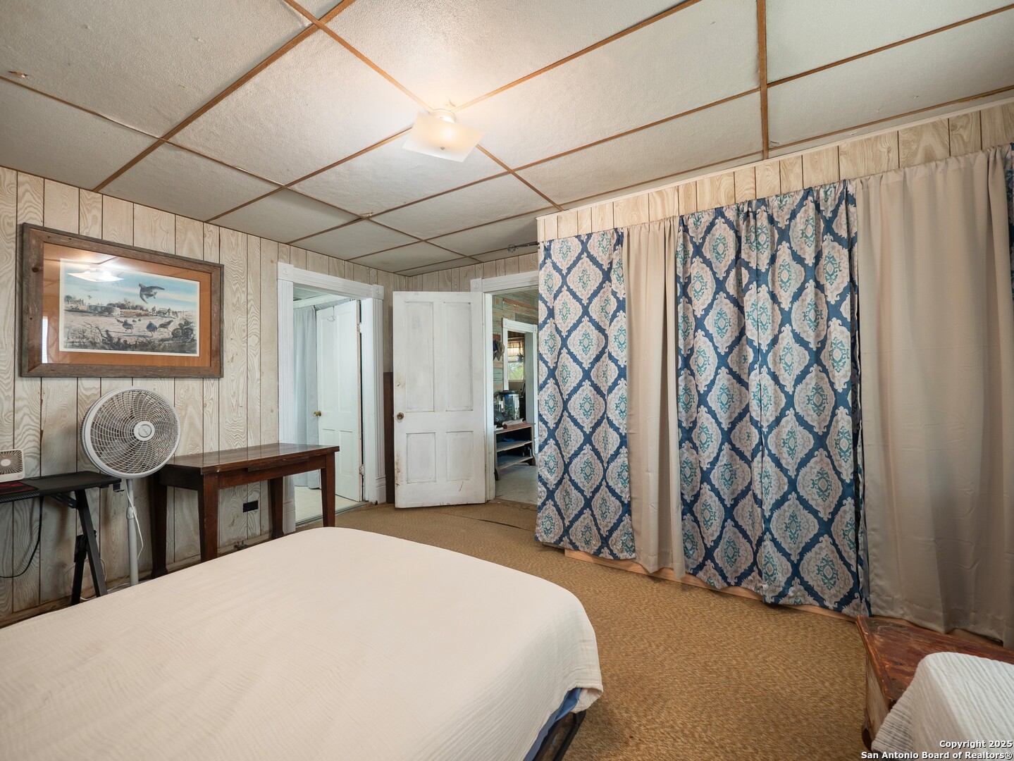 6147 Pfeil Road Schertz, TX 78154 - Photo 20 of 47 a bedroom with a bed and a table