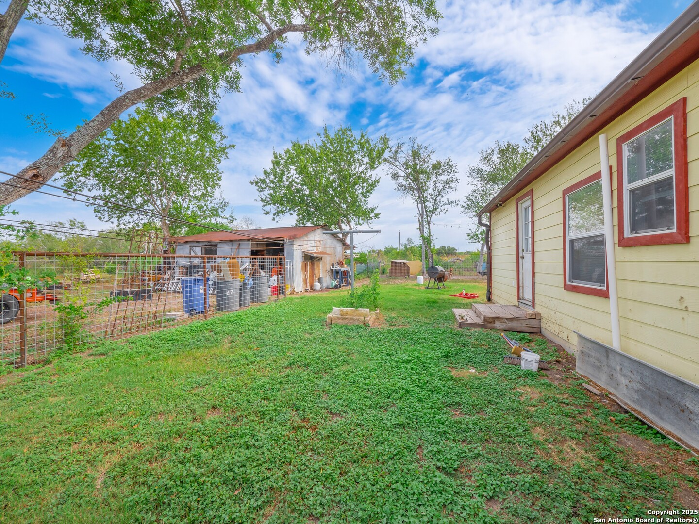 6147 Pfeil Road Schertz, TX 78154 - Photo 27 of 47 a view of a house with backyard and a tree