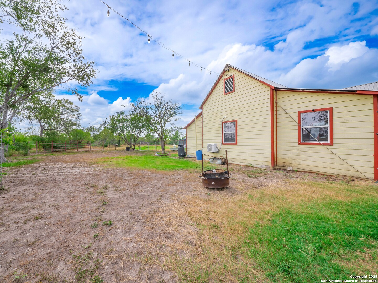 6147 Pfeil Road Schertz, TX 78154 - Photo 29 of 47 a view of a house with backyard and trees in the background