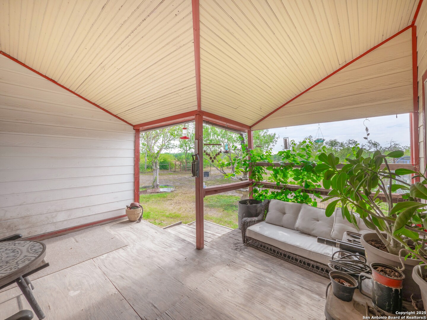 6147 Pfeil Road Schertz, TX 78154 - Photo 31 of 47 a house view with a sitting space and garden