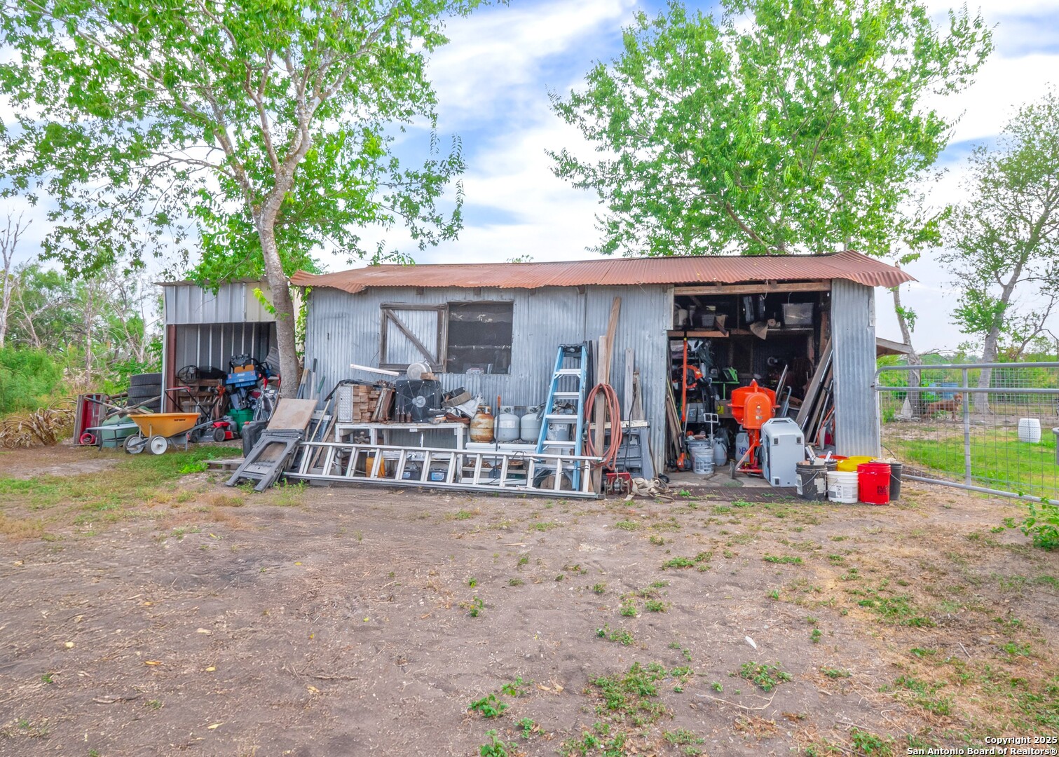 6147 Pfeil Road Schertz, TX 78154 - Photo 42 of 47 a view of a chairs and tables in patio