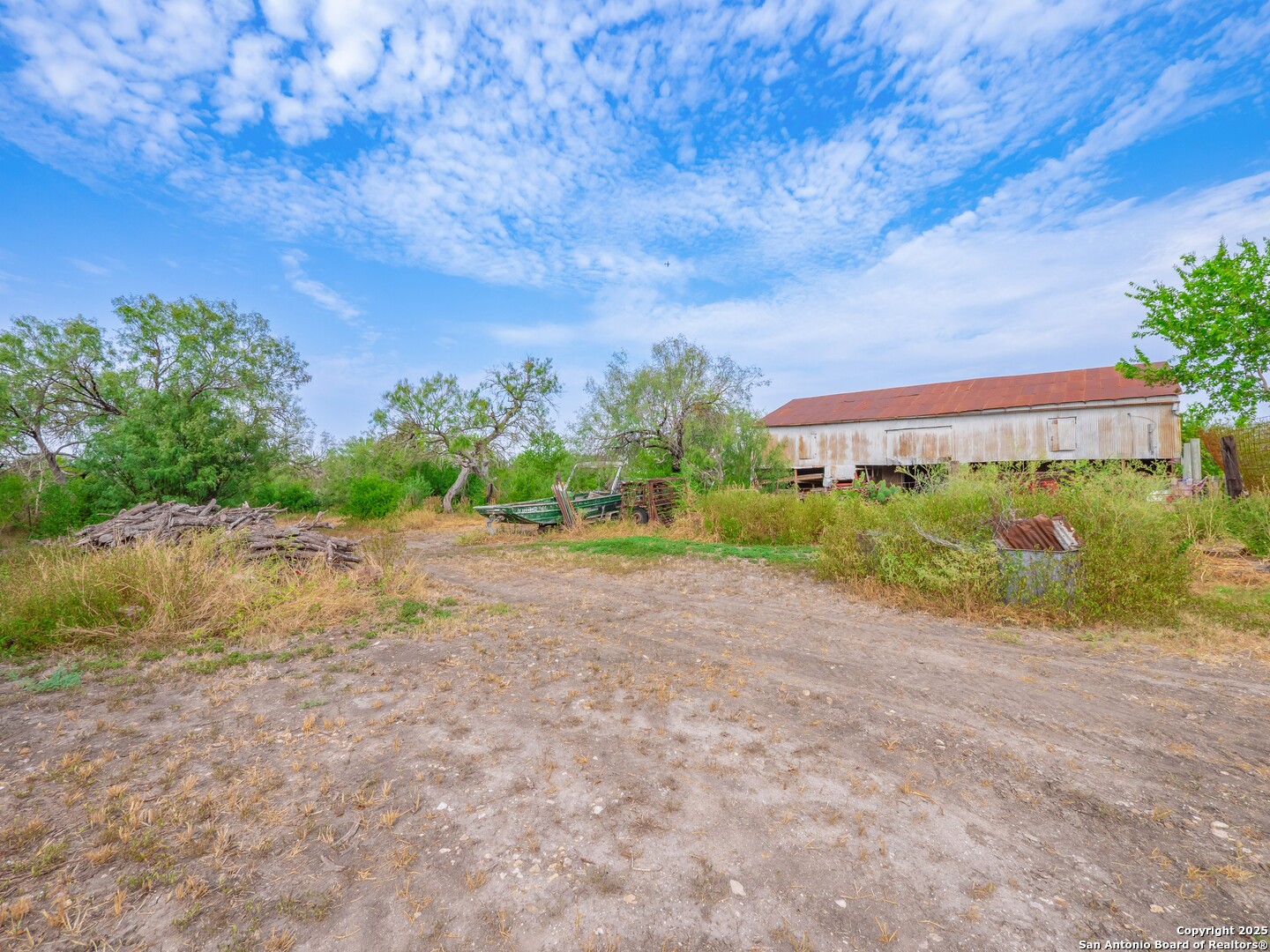 6147 Pfeil Road Schertz, TX 78154 - Photo 43 of 47 a view of a big yard with plants and large trees