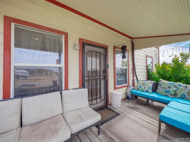 a living room with furniture and a gate