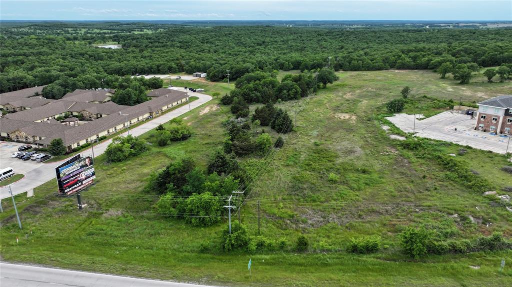 287 South Access Road Bowie, TX 76230 - Photo 11 of 20 an aerial view of residential houses with outdoor space and trees