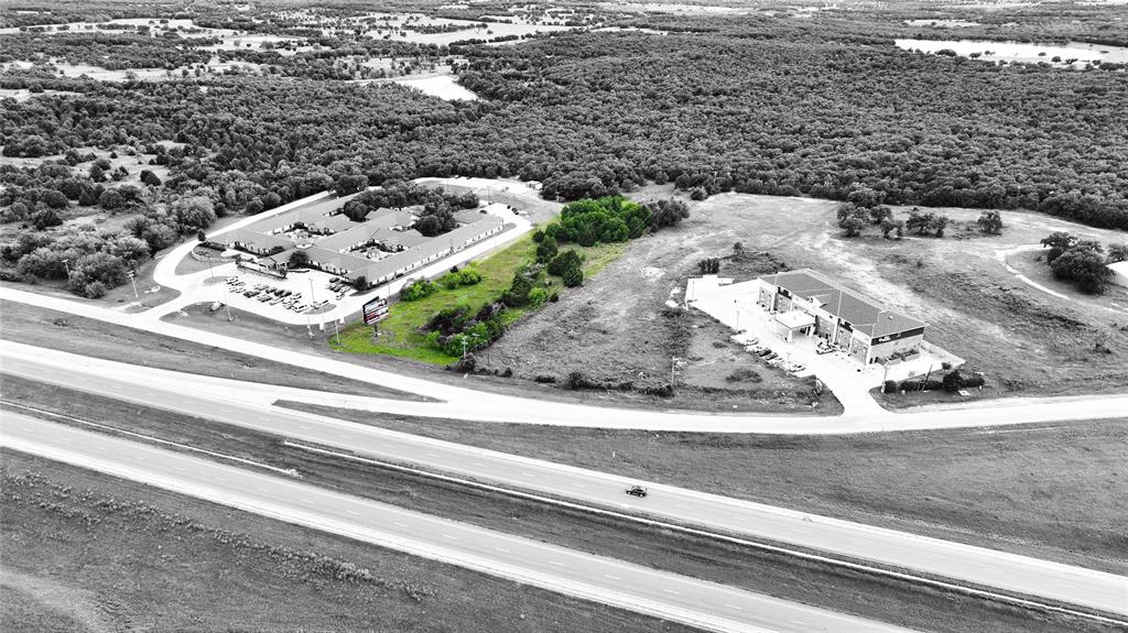 287 South Access Road Bowie, TX 76230 - Photo 13 of 20 a view of a floor to ceiling window and a parking